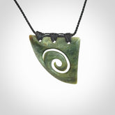 Hand carved contemporary jade koru jewellery. Made by Donna Summers for NZ Pacific from New Zealand greenstone.